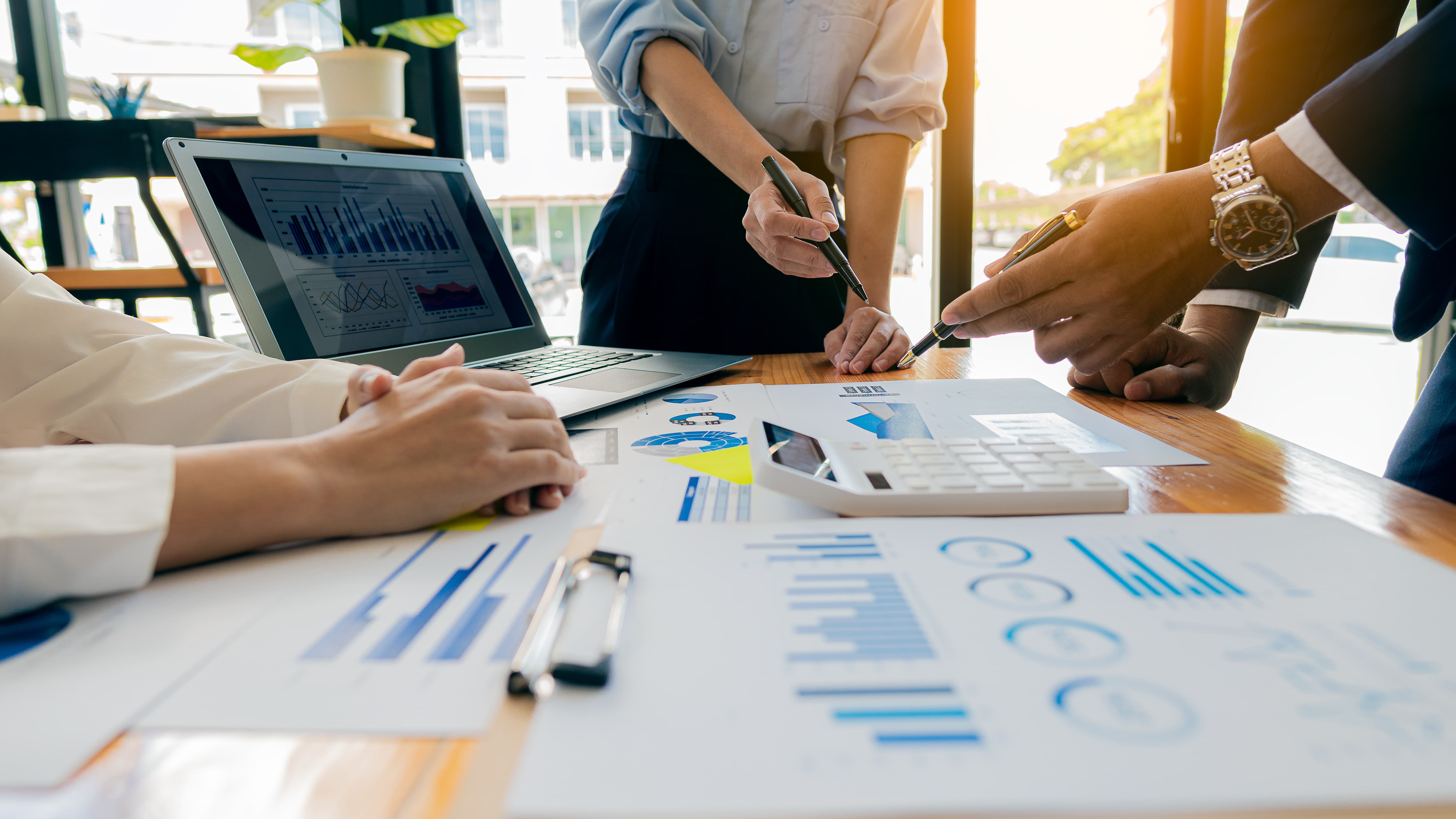 Team of professionals work on a data project